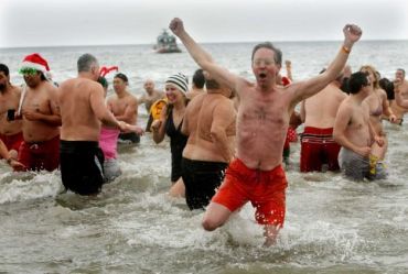 A member of the Coney Island Polar Bear Club celebrates (Credit: Monika Graff, Getty Images)