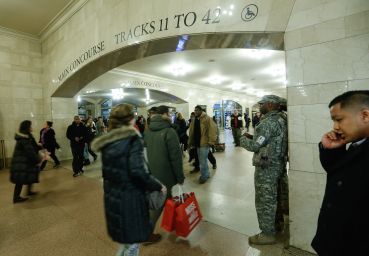 Military officers guard Grand Central Terminal, a potential terrorist target. (Photo by Cem Ozdel/Anadolu Agency/Getty Images)