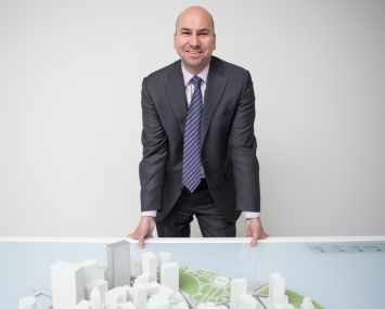 Dennis Friedrich in front of a scale model of Lower Manhattan (Photo: Arman Dzidzovic/Commercial Observer).
