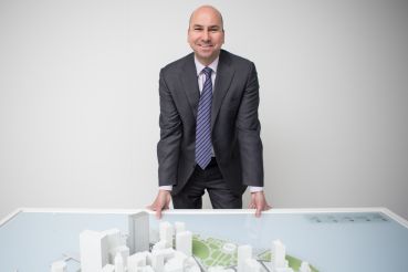 Dennis Friedrich in front of a scale model of Lower Manhattan (Photo: Arman Dzidzovic/Commercial Observer). 