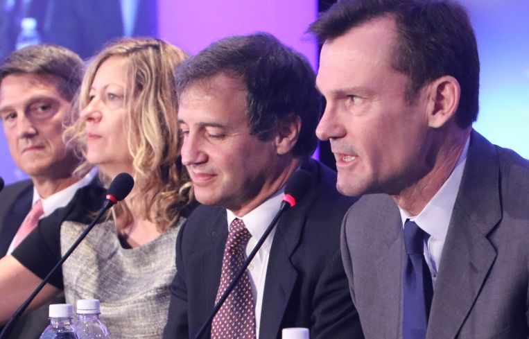 A group of panelists speak at CREFC.