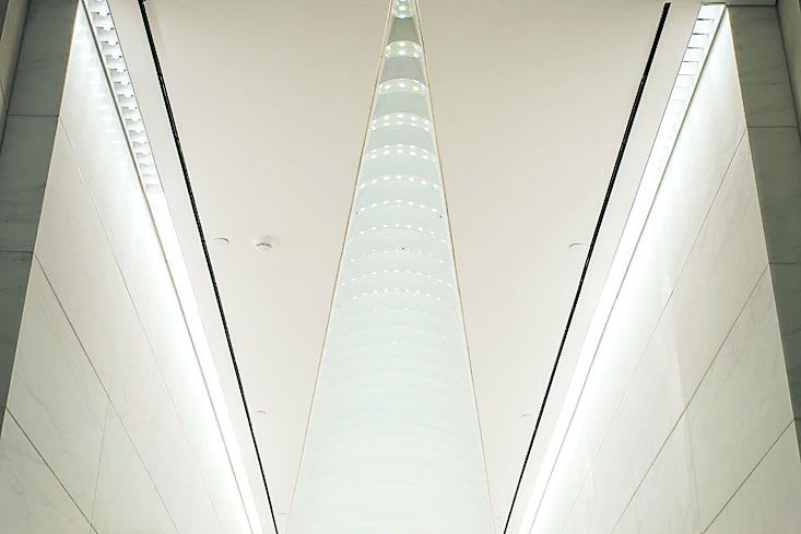 The hourglass facade of the building runs on the ceiling of the lobby as well (Photo: Sasha Mazlov/For Commercial Observer).