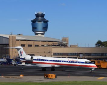 An American Airlines jet taxis on the runway of LaGuardia Airport (Photo: Bruce Bennett/Getty Images).