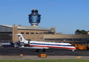An American Airlines jet taxis on the runway of LaGuardia Airport (Photo: Bruce Bennett/Getty Images). 