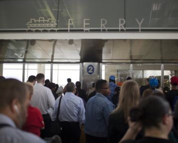 Morning commuters on Staten Island wait to  board a ferry (Photo: Robert Nickelsberg/Getty Images).