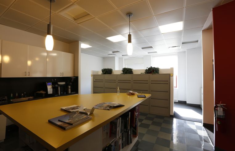 The revitalization will focus on bringing more light into the office. This is a picture of the current pantry (Photo: Corgan).