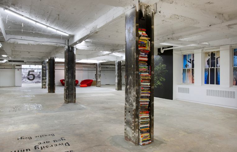 For a more gritty feeling on the ninth floor, columns were stripped down to the steel and books filled in the empty spaces (Photo: Kevin Chu and Sharon Mclaughlin).