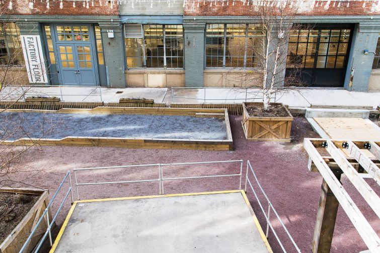 The exterior of Time Inc.'s showroom space, with a bocce court in front (Photo: Kaitlyn Flannagan/  For Commercial Observer).