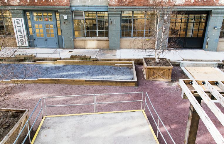 The exterior of Time Inc.'s showroom space, with a bocce court in front (Photo: Kaitlyn Flannagan/ For Commercial Observer).