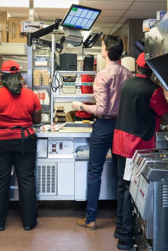 Employees working in the kitchen at Chick-fil-A at 1000 Avenue of the Americas (Photo: Kaitlyn Flannagan/Commercial Observer).
