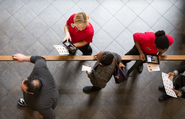 Customers in line get their order taken on iPads by employees at Chick-fil-A at 1000 Avenue of the Americas (Photo: Kaitlyn Flannagan/Commercial Observer).