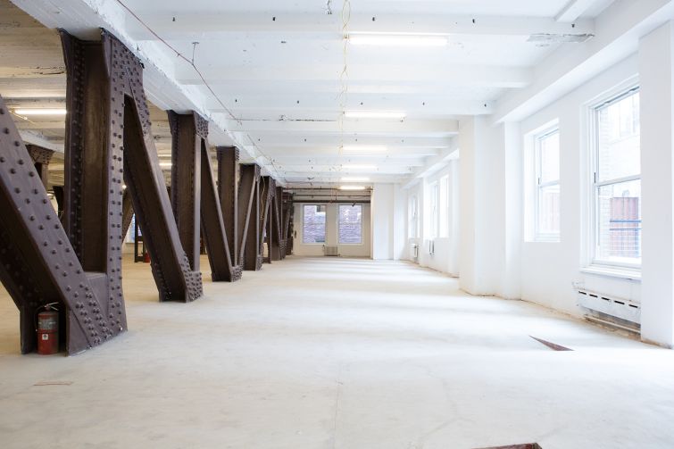 Uncovered steel columns on the 10th floor next to open space (Photo: Sam Ortiz/ For Commercial Observer). 
