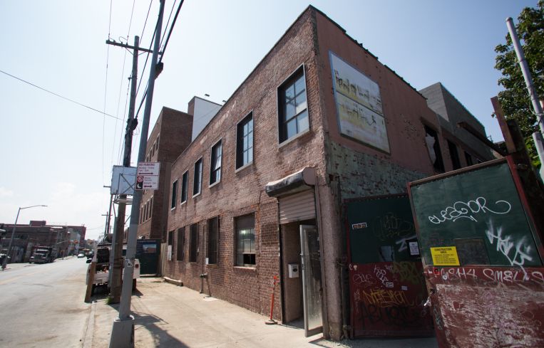 The façade of 599 Johnson Avenue was stripped of a pinkish mortar and reveals original brick (Photo: Aaron Adler/ for Commercial Observer).