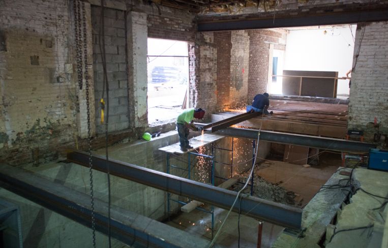 Workers rebuilding the ground floor after extending the cellar (Photo: Aaron Adler/ for Commercial Observer).