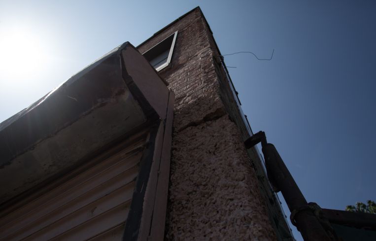 A small section of the pinkish mortar façade remains on the building for the time being (Photo: Aaron Adler/ for Commercial Observer).