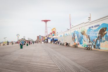 Coney Island boardwalk, which features the landmarked Parachute Jump. 