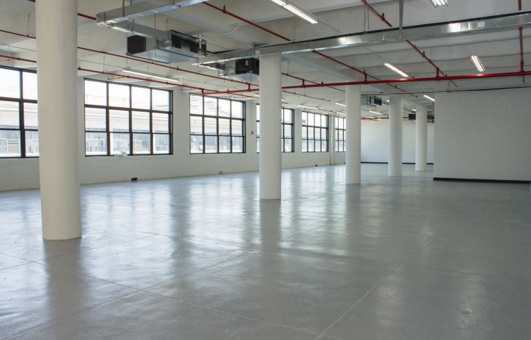 The floors feature 14 to 14 ceiling heights with polished concrete floors and large windows (Photo: Jemma Dilag/ For Commercial Observer).