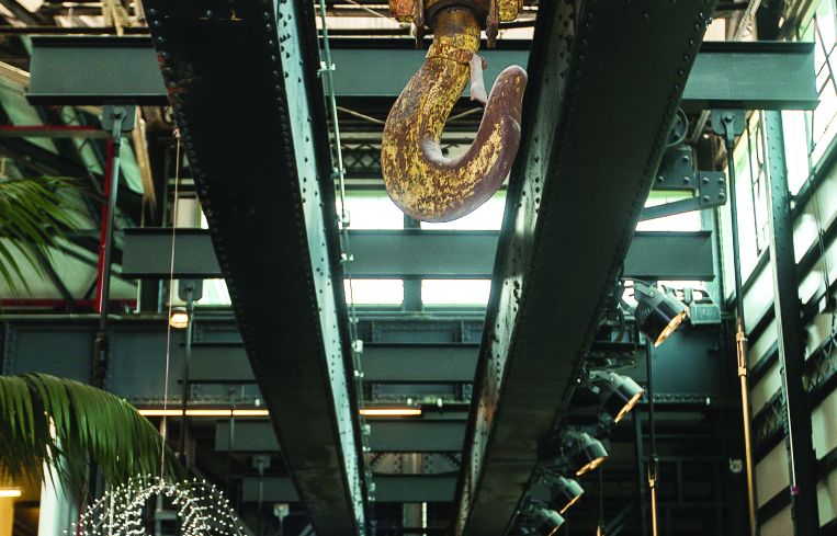 One of the old gantry cranes in Building 128, which are now used to suspend three bridges across New Lab in the Brooklyn Navy Yard. Photo: Emily Assiran/Commercial Observer