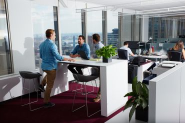 JLL's new office at 28 Liberty Street come with plants and breathtaking views of Lower Manhattan. Photo: Yvonne Albinowski/For Commercial Observer