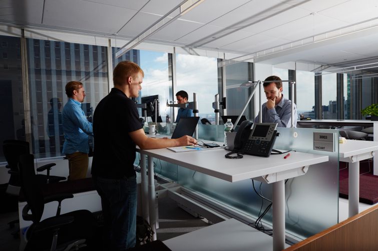 Standing desks help workers maintain healthy bodies. 