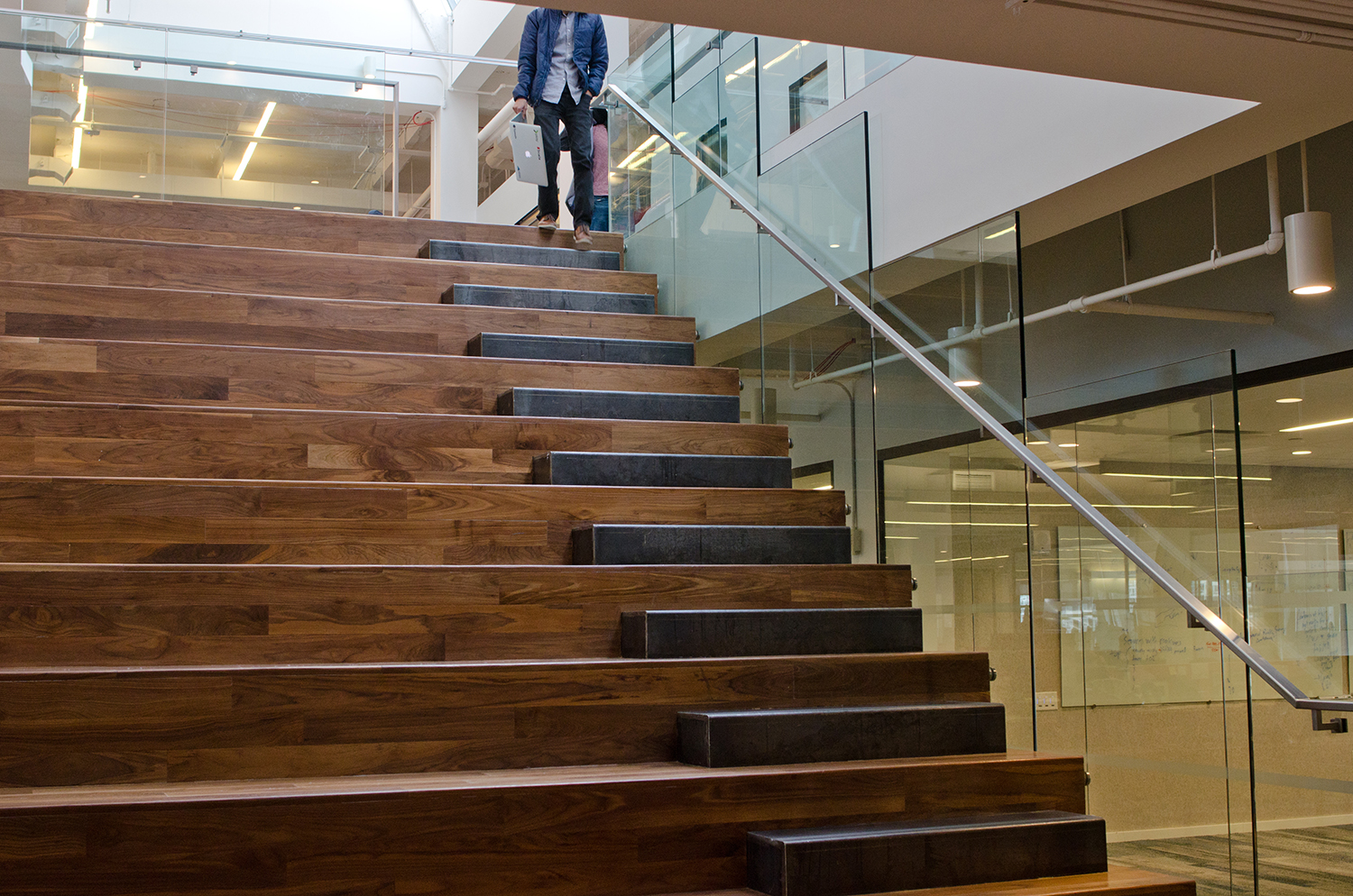 Yodle's interconnected staircase is part of a modern, open office, which features desks with treadmills in its latest expansion. Photo: Molly Stromoski For Commercial Observer.  