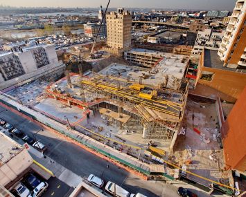 F&T Group's Tangram project, a 1.2-million-square-foot development in Flushing under construction, will bring the neighborhood's first movie theater in three decades in a 225,000-square-foot retail podium. Photo: F&T Group.