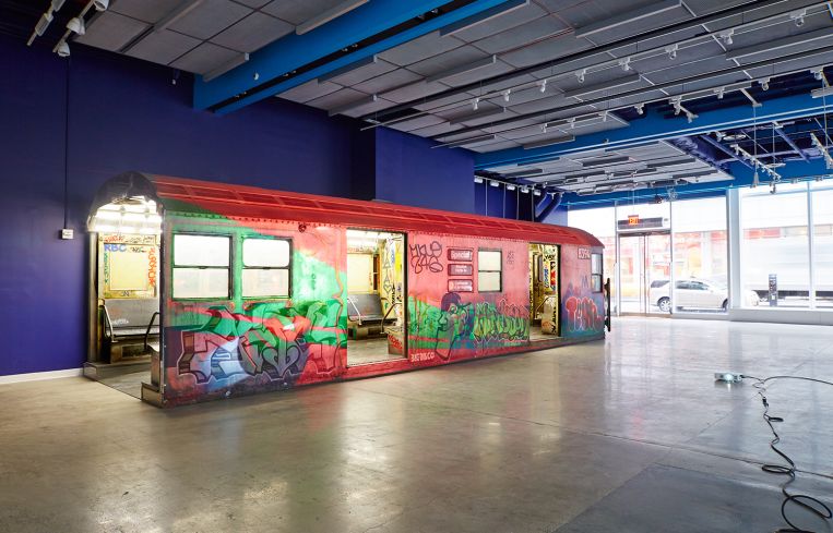 The train car will be lit up in Christmas-themed holiday colors through January. Photo: Yvonne Albinowski/For Commercial Observer.