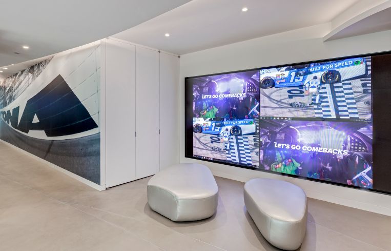NASCAR has a nearly 10-foot wide video screen near the entrance to its office, which streams its races.