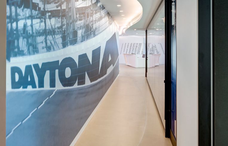 In the hallway, there is a photo of the Daytona International Speedway.