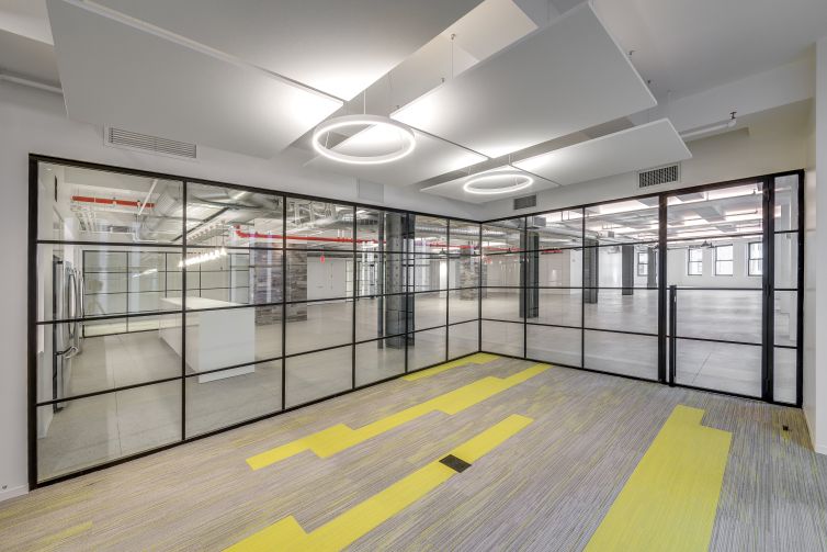 The glass walls have a black steel incorporated in the pattern to make it look different from other modern glassed offices. Photo: JEMB Realty