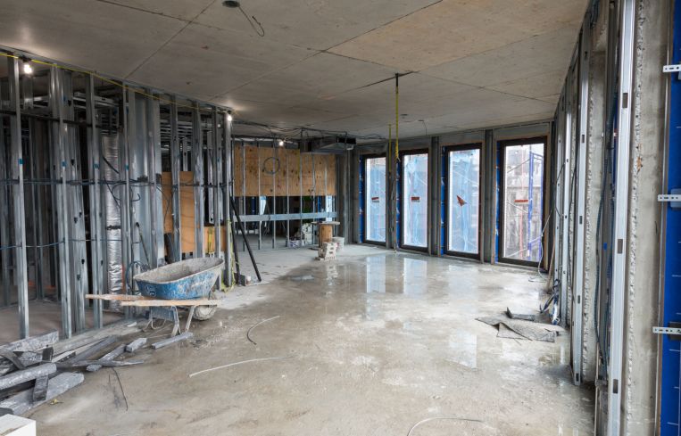 The soon-to-be completed living area and kitchen of a rear facing penthouse unit. Photo: Melissa Goodwin/For Commercial Observer