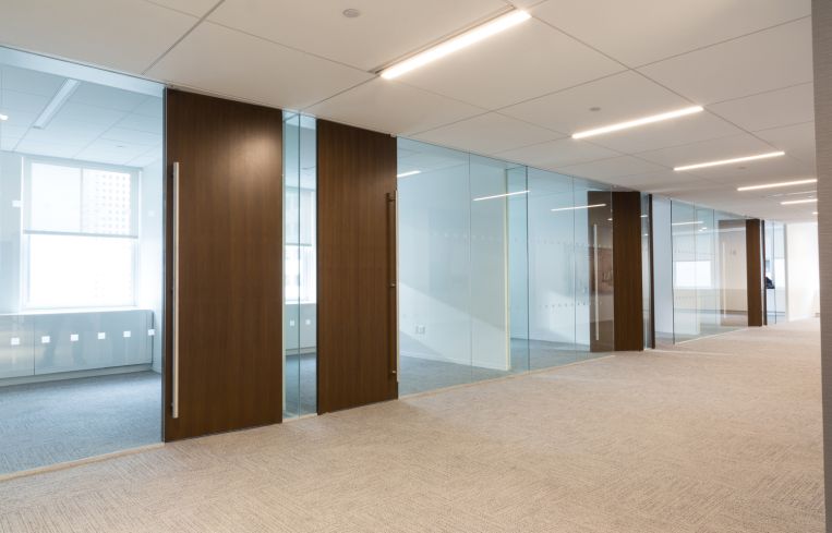 Private offices which feature glass walls to let light into the common areas of the office on the 19th floor. Photo: Melissa Goodwin/For Commercial Observer