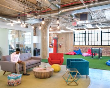 The office features multicolored chairs and carpeting. Photo: MKDA