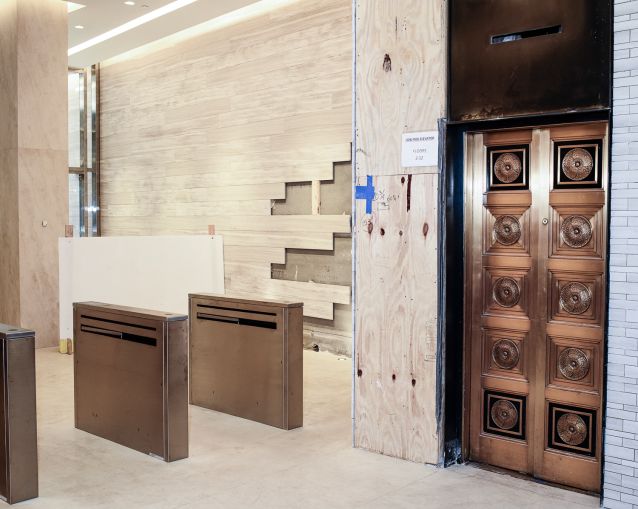 The only historical thing landlords could save from 40 Exchange Place was the brass elevator doors. Photo: Robert Paul Cohen/For Commercial Observer