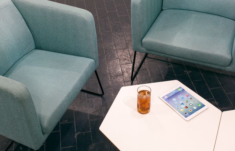 The red brick floors were sanded down and covered with a dark gray epoxy. Image: JIDK