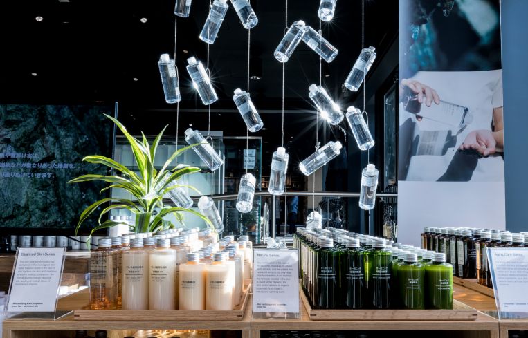 The ceilings and steel beams are black to allow the floating art installations to stand out more. Photo: Lucas Roy