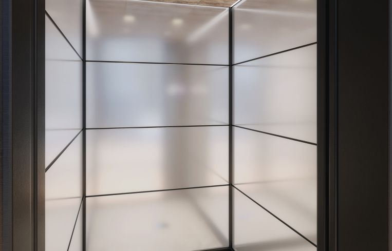 The landlords have installed 11 new elevators with marble floors, glass walls and white oak ceilings. Rendering: Cove Property Group