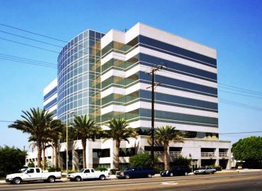 5805 Sepulveda Blvd. in Sherman Oaks, counts Caine & Weiner, which will now be headquartered in the 8-story building, among its tenants. Photo: Commercial Asset Group