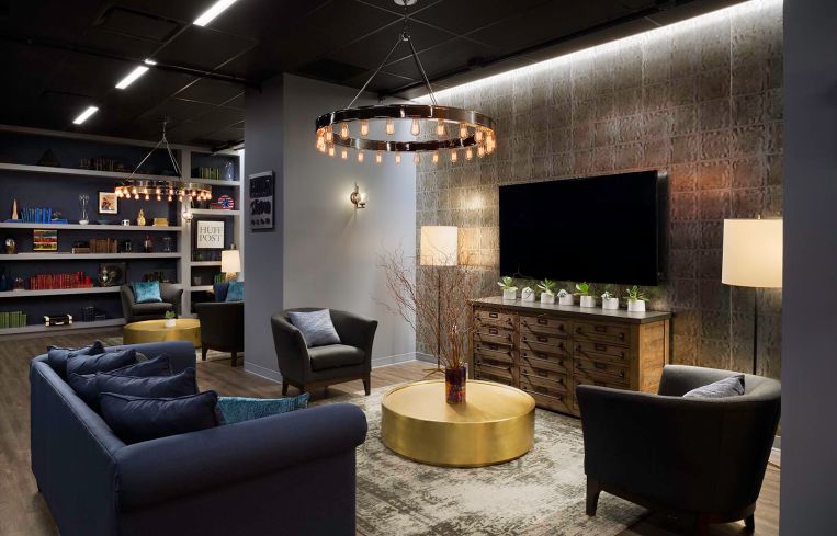 The lounge in the basement for parties features relaxing furniture and finishes.