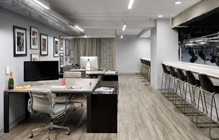 There are office stations on a mezzanine level overlooking the studio.