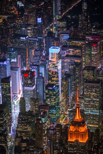 The Empire State Building, 4 Times Square and 1 Bryant Park lit up "Amazon Orange." Image: New York City Economic Development Corporation
