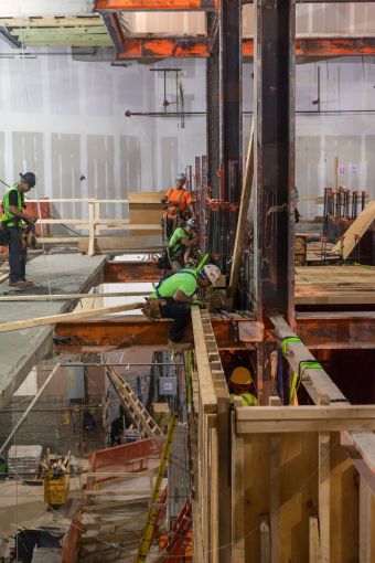 Workers installing the core.