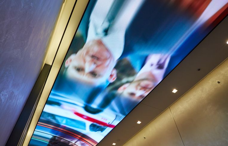 The screen will have images of people trending and in the news.