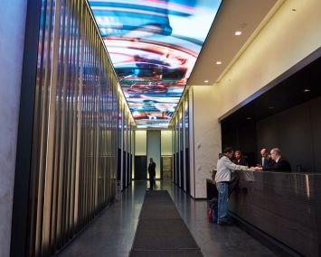 ESRT's new ceiling screen at 250 West 57th Street is the main feature of the new Gensler-designed lobby.