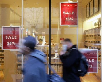 Pedestrians walk past a Bon-Ton store in Illinois.