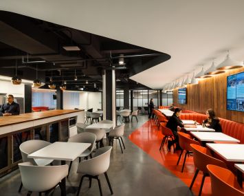 Curving lines on the ceiling and floors are created by the borders of colors.