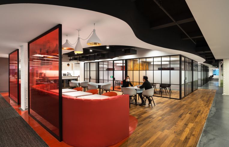 Red is AlphaSights signature color, and the only color used in the offices (save for the wood) that isn't a neutral hue such as black, white or gray.