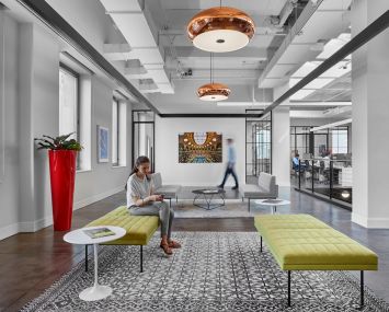 Artwork and copper lights help define the office.