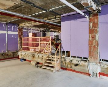 This raw space on the second floor, which used to be the MTA's money counting floor, will become four production studio rooms. Since the building has 10-foot ceiling heights, NYU dropped the floors four feet and borrowed height from the 20-foot ceiling heights in the ground floor to accommodate the studios.