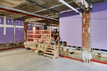 This raw space on the second floor, which used to be the MTA's money counting floor, will become four production studio rooms. Since the building has 10-foot ceiling heights, NYU dropped the floors four feet and borrowed height from the 20-foot ceiling heights in the ground floor to accommodate the studios.